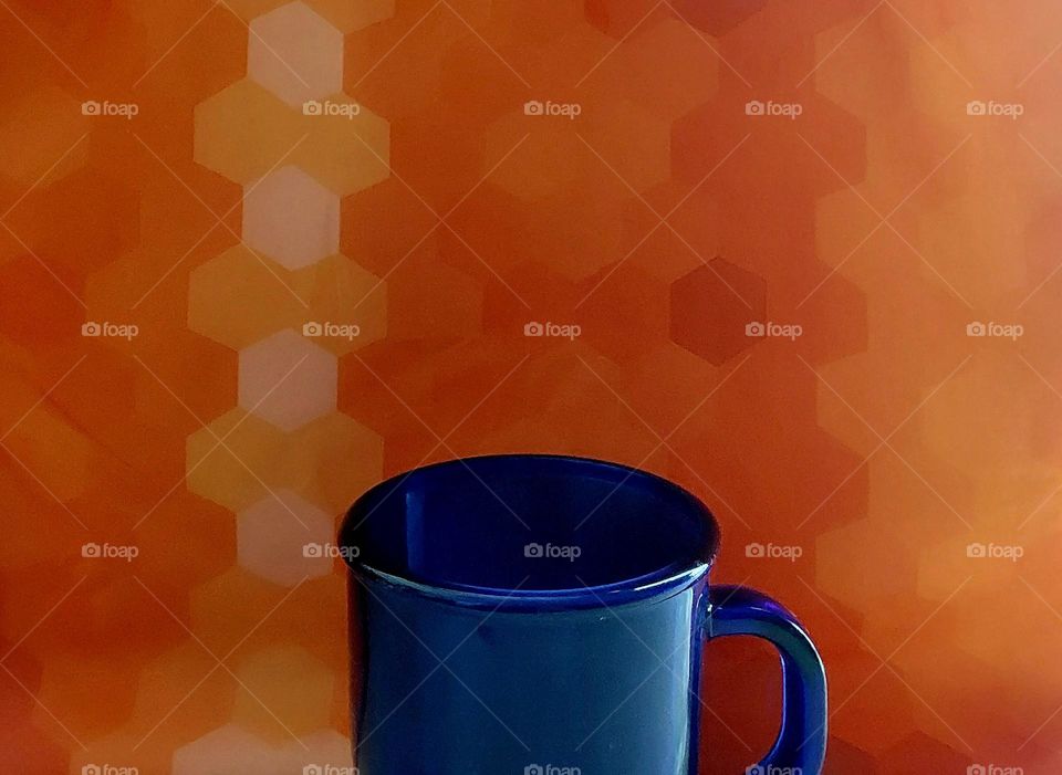 blue mug on orange background