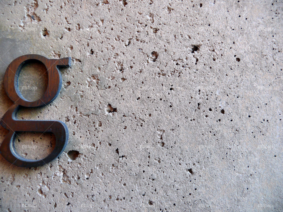 Close-up of wooden letter on wall in Berlin, Germany.