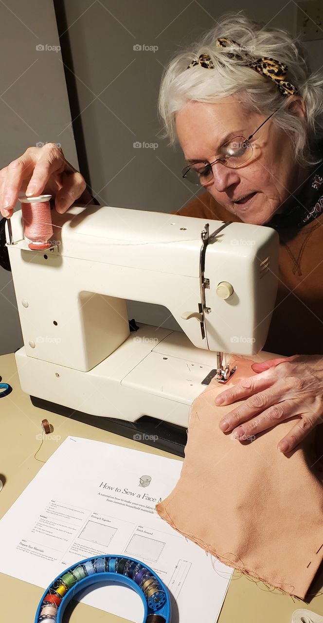 Sewing, with instructions, face masks to get us out of the house safely. Busy hands sewing.