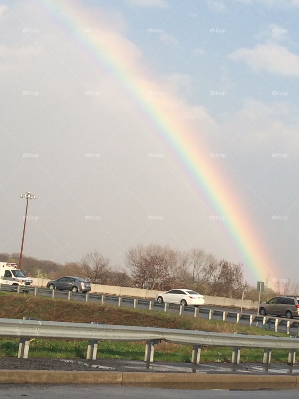 Rainbow along roadway