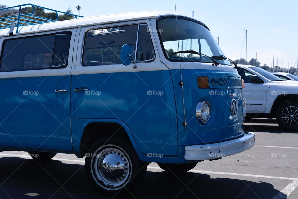 Blue and White Microbus Van