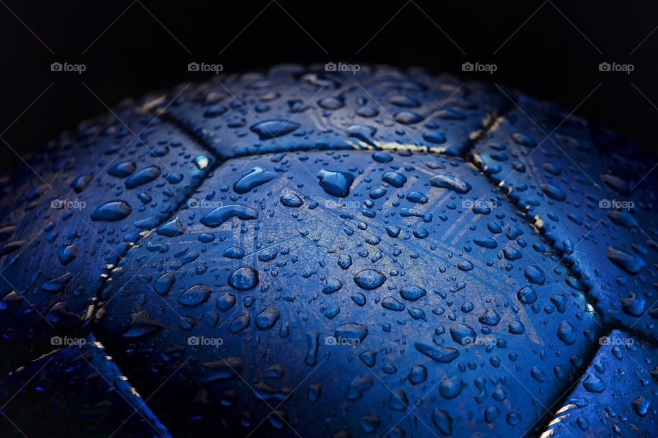 Rain drops on a football