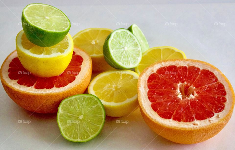 Fruits! - Grapefruit, lime and lemon halves on white background