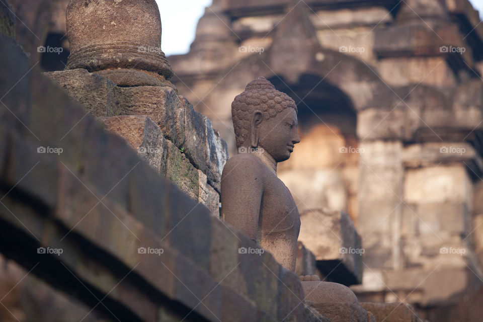 Buddha statue at the Borobudur temple in Central Java, Indonesia 