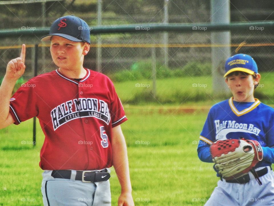 Young Boys Playing Little League Baseball