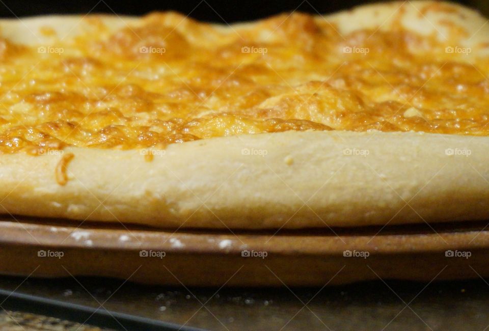 Fresh out of the oven golden cheesy bread.