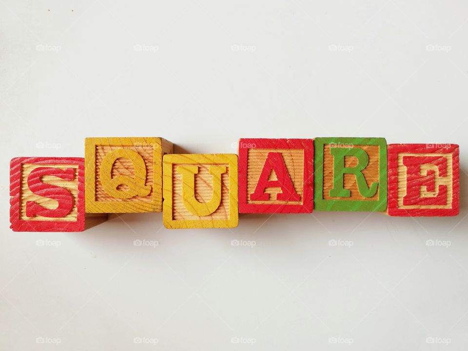 Written: "square" with wooden cubes