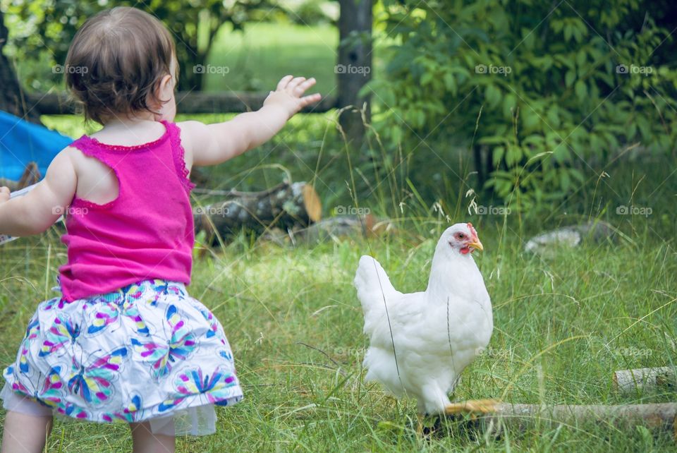 A girl and her chicken