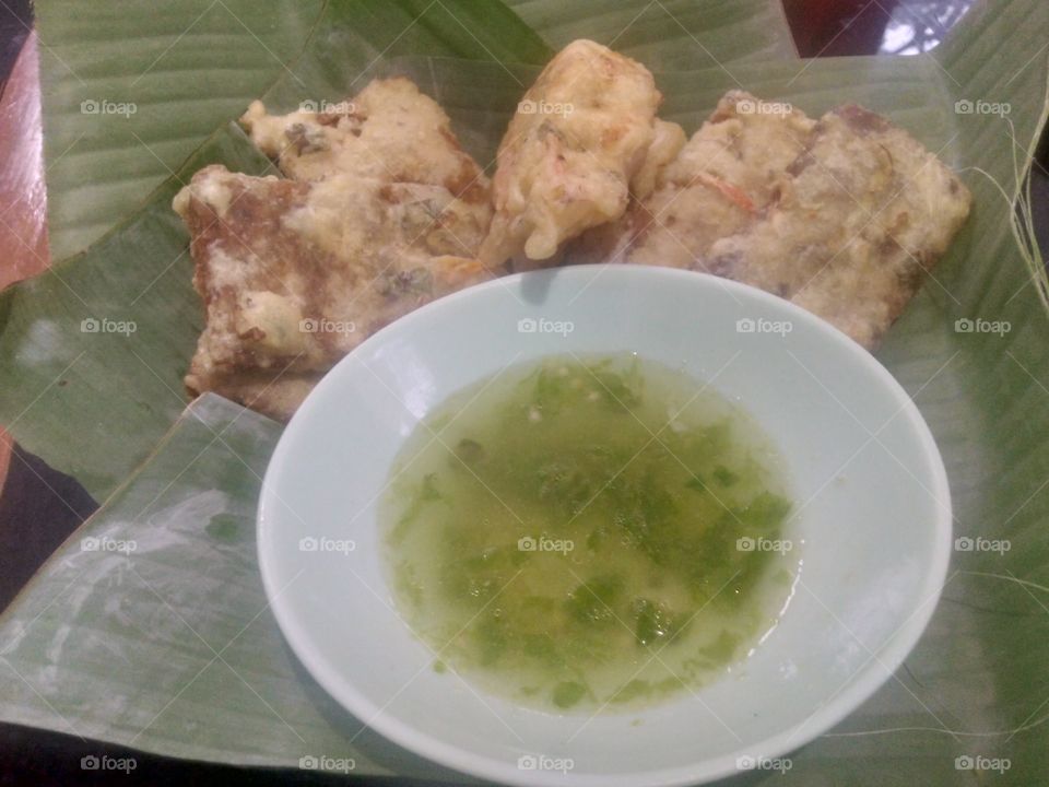 fried oncom and tamarind sauce on banana leaf