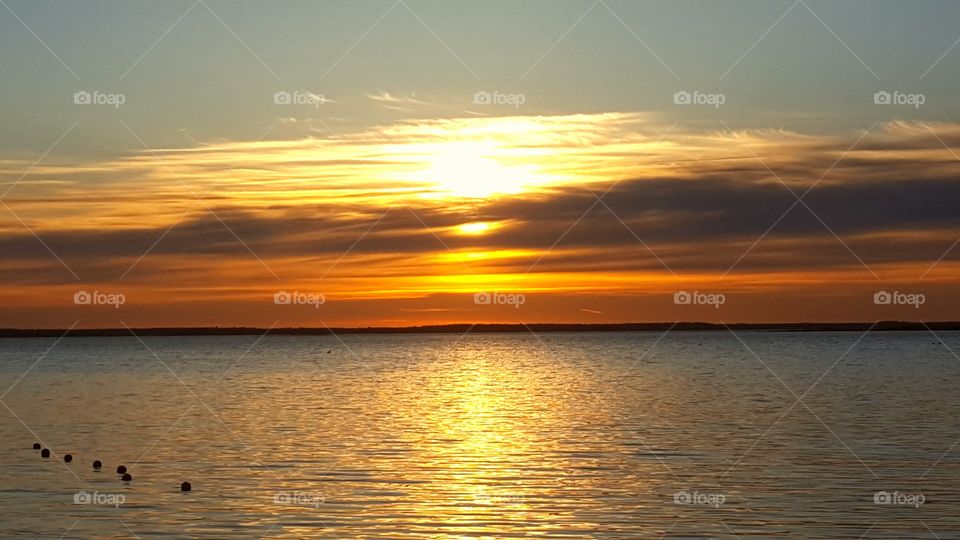 Scenic view of sea at sunset
