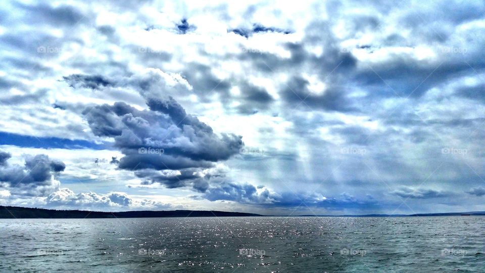 clouds. driftwood beach coupeville wa.
