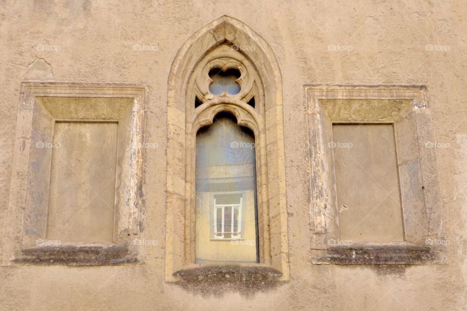 Old window with reflection of new window 