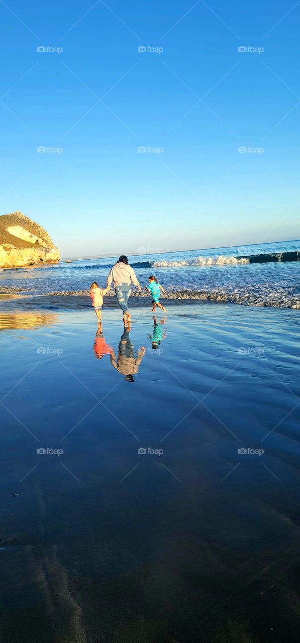 Togetherness and their reflection in the ocean.