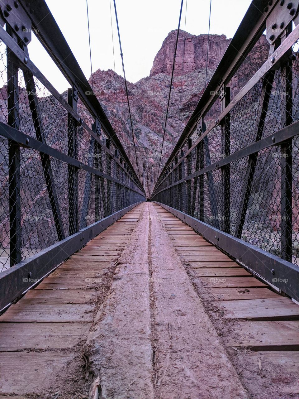 Black metal bridge with wooden boars in the Grand Canyon USA