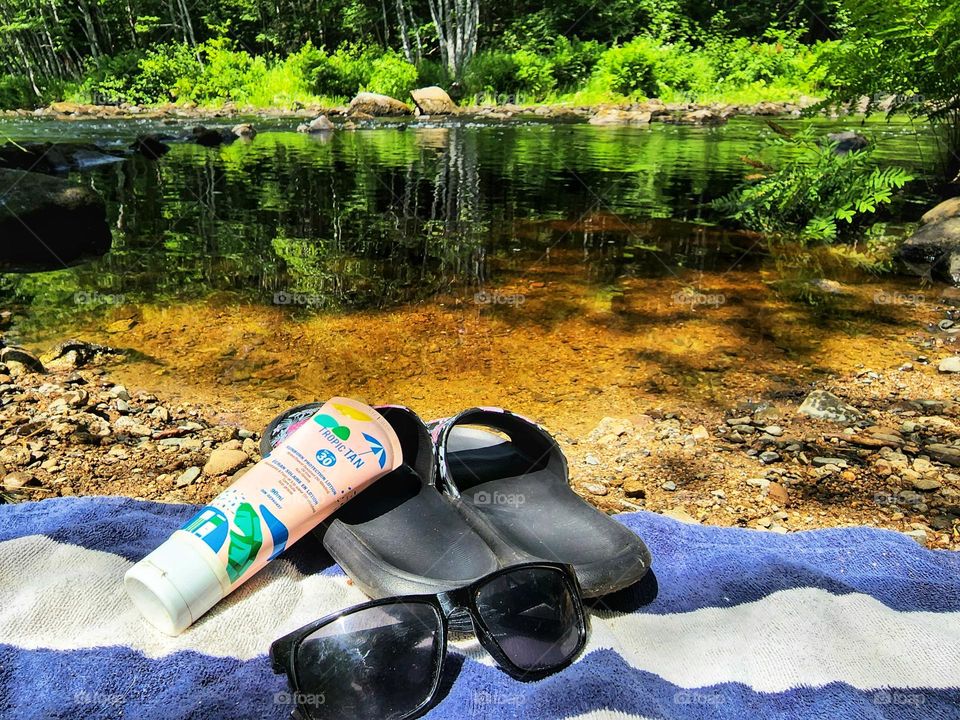 Summer sun tanning by the beautiful river.