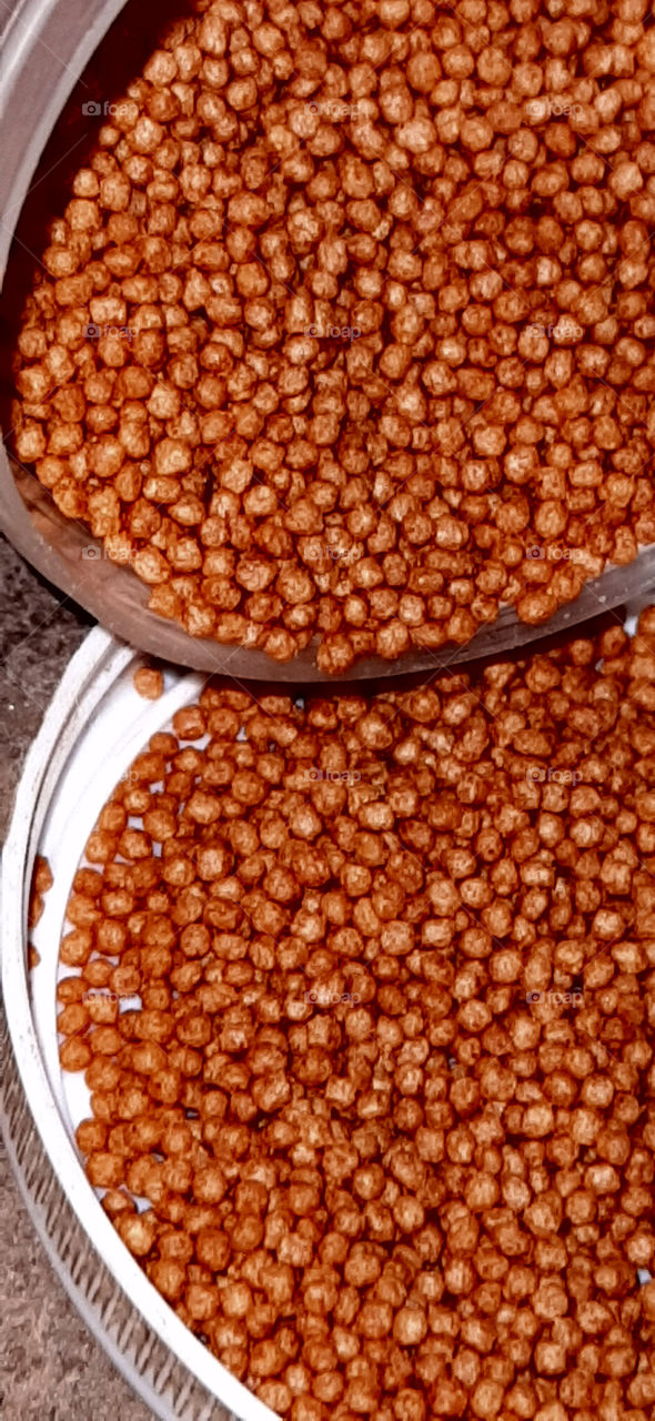 World in macro. Micro pellets for fish feeding captured.