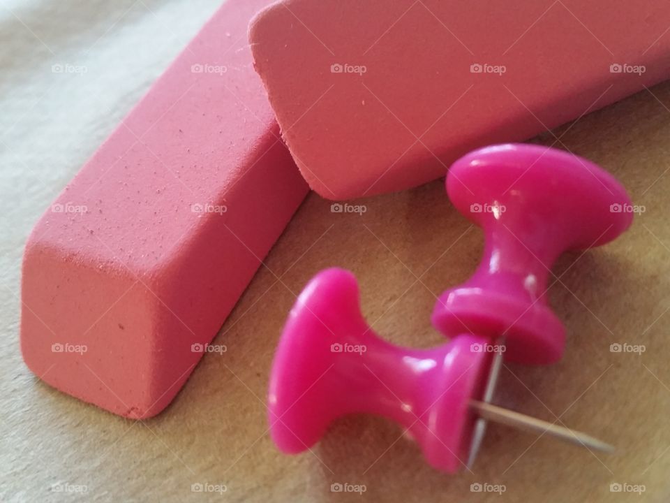 pink erasers and pink push pins