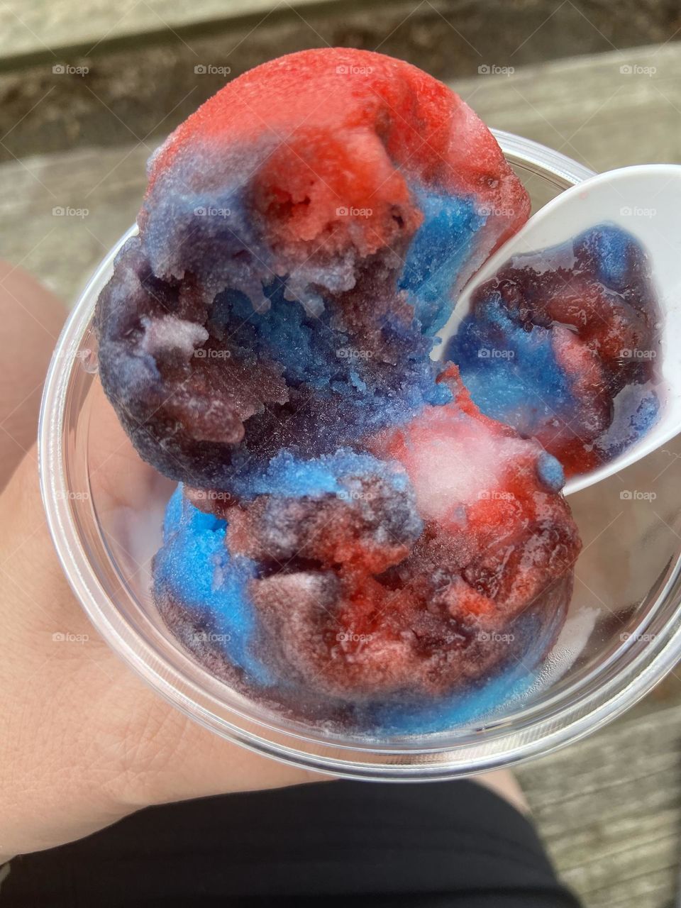 Rainbow Italian ice enjoyed at the fair. A tasty way to beat the heat on a hot summer day. 
