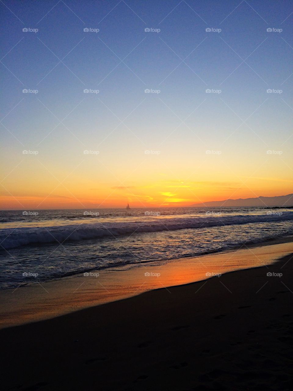 Dramatic sky reflecting in sea