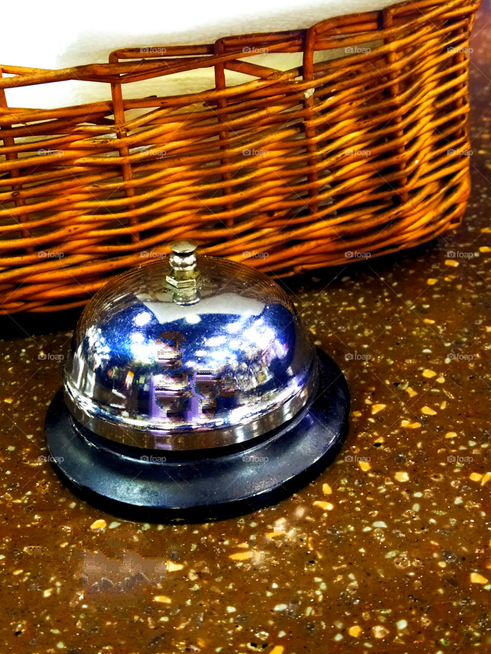 Bell and wicker basket on the table