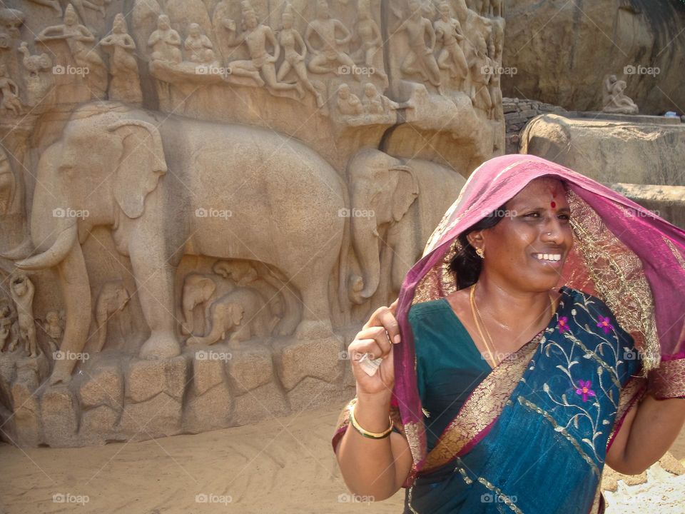 Indian women in front of an architecture in Mahabalipuram a world heritage site 