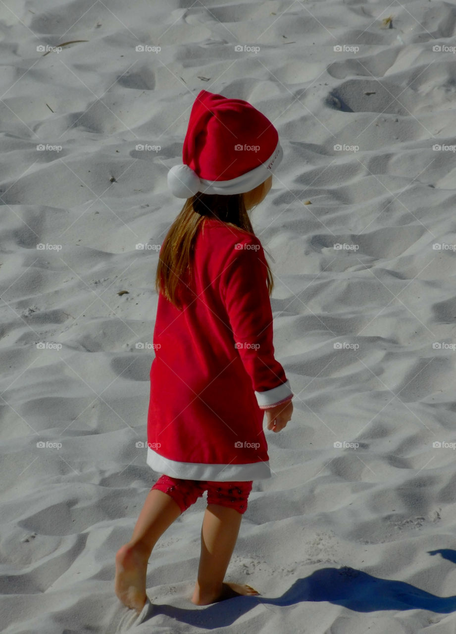 Walking on the beach in her new Hello Kitty dress!