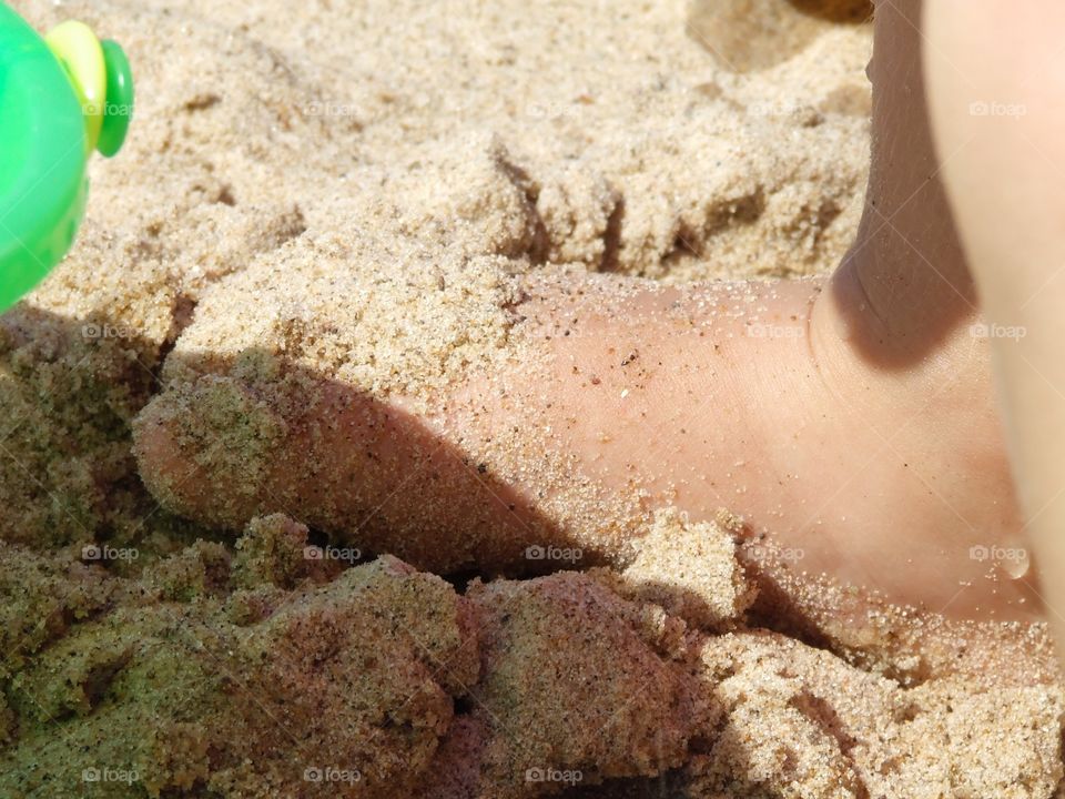 Baby foot in sand