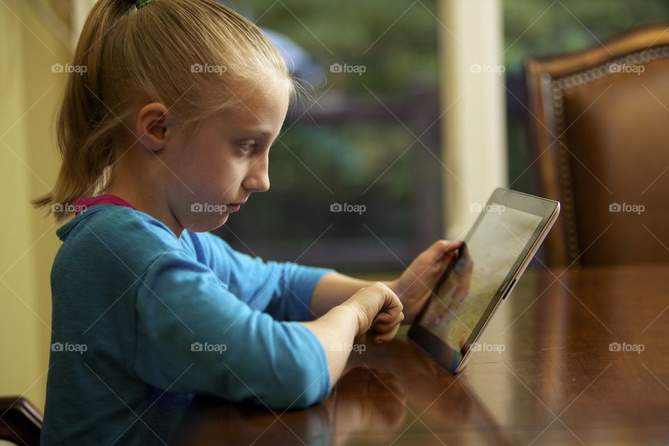 Young girl using iPad 