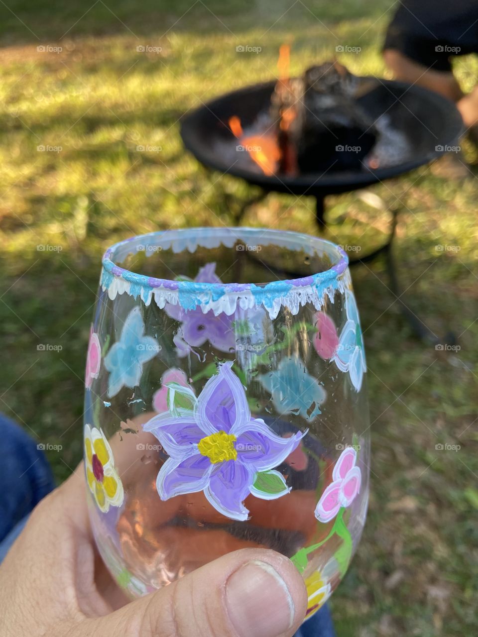 A glass of wine and a non fire