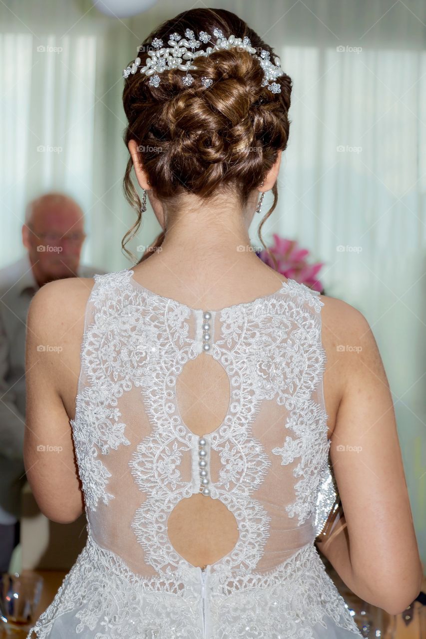 Back view of a bride dress and hairstyle