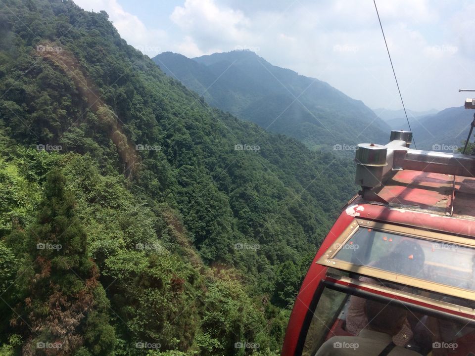 Cable car descending on Chinese mountain 1