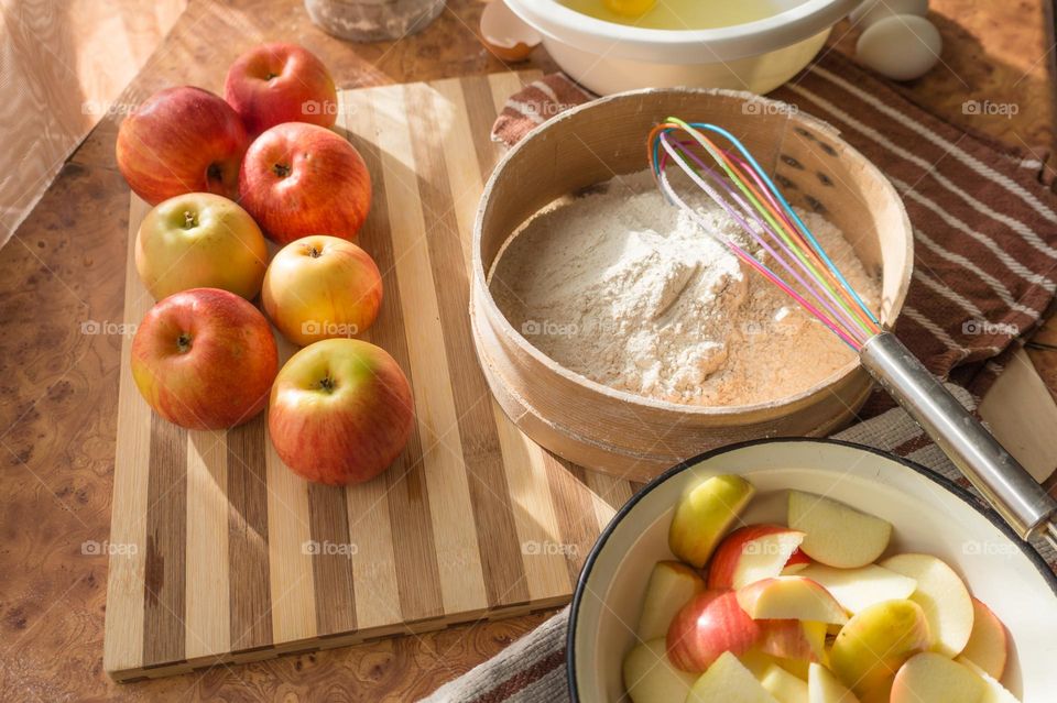 Making homemade puffed apple pie with eggs, sugar and flour.