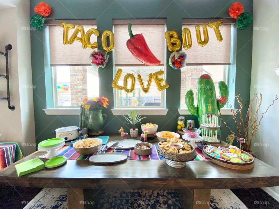 Food set up for a colorful fiesta celebrating engagement!