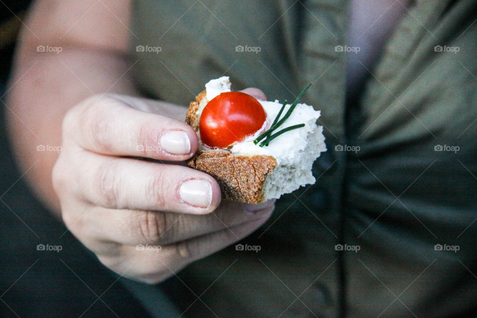 Close-up of a person holding sandwich