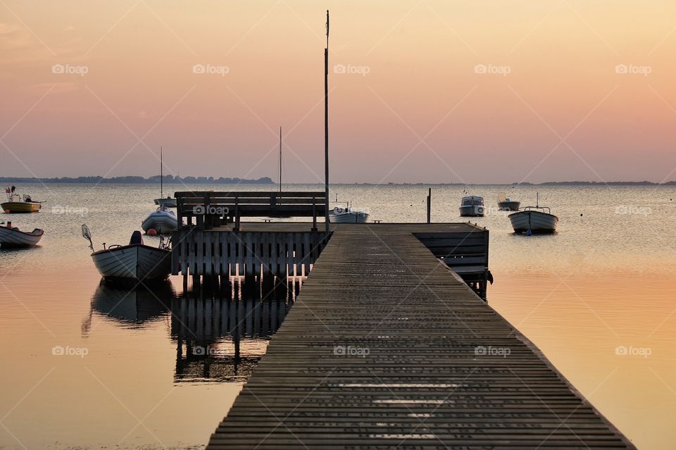 Jetty against dramatic sky