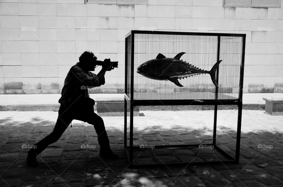 My friend Mongon during an Exhibition of fish sculptures in metal in Havana