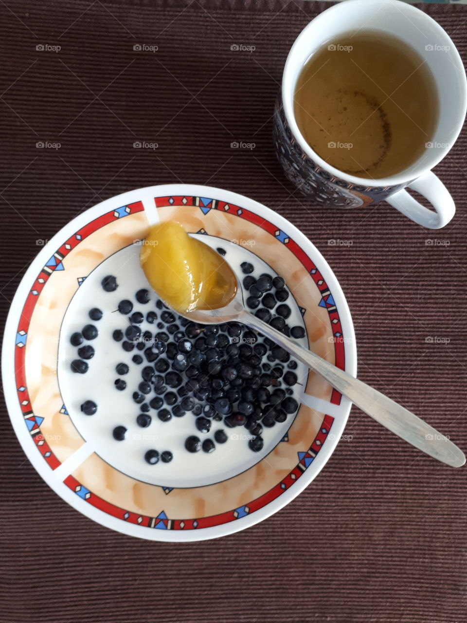 Oatmeal with milk, honey and blueberries. Healthy breakfast