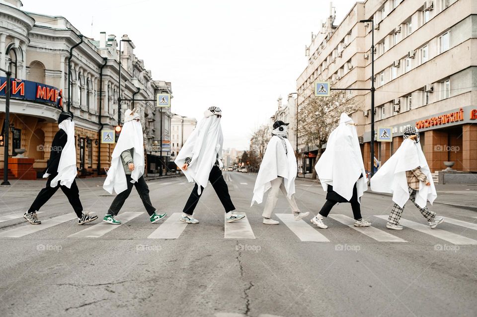 Teenagers in ghost costumes. Halloween party