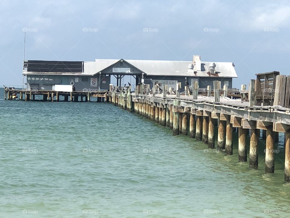 Anna Maria City Pier from shore. This pier is now closed due to hurricane damage. The city is working to renovate and rebuild the amazing pier. 