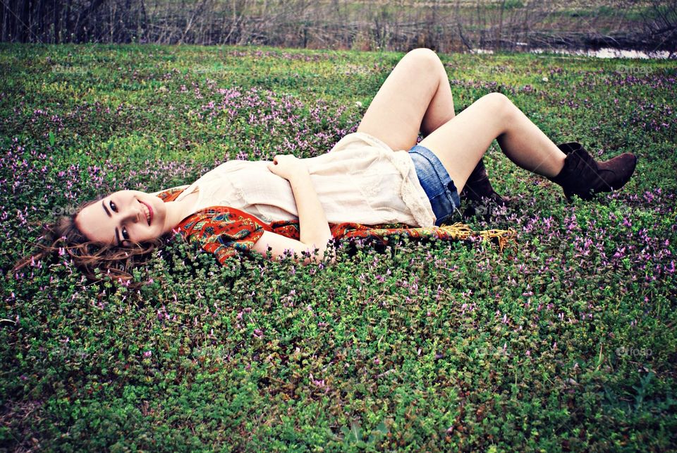 Spring Flowers . Teen girl laying in pretty spring flowers 
