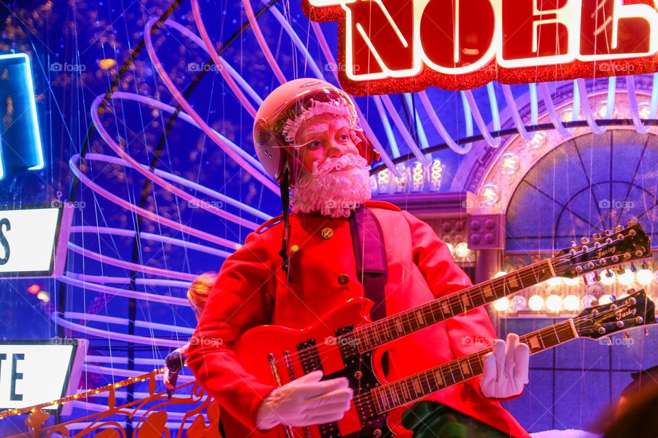 Santa Claus playing guitar, holiday spirit