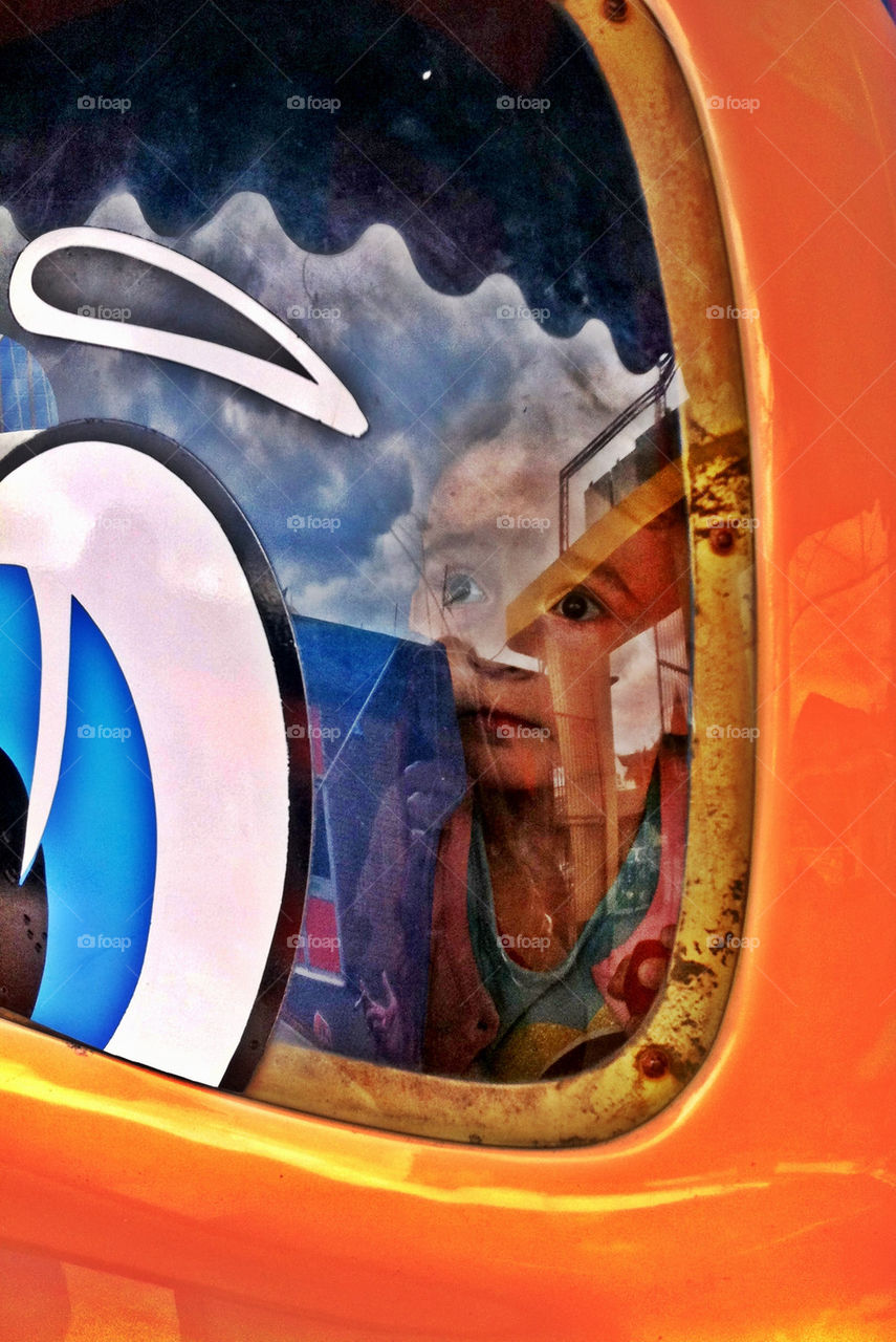 Little girl looking out of window