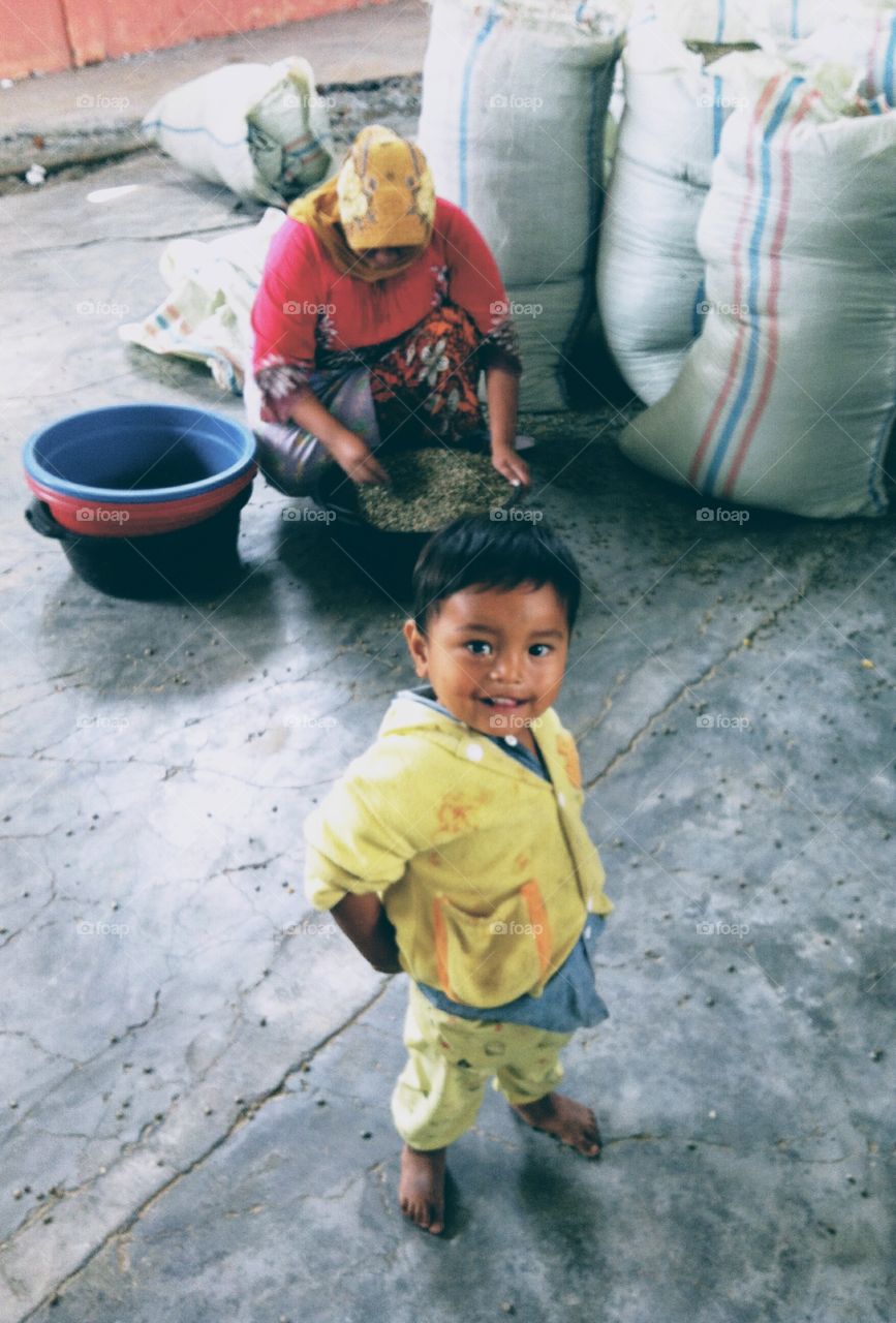 Child in coffee factory Indonesia