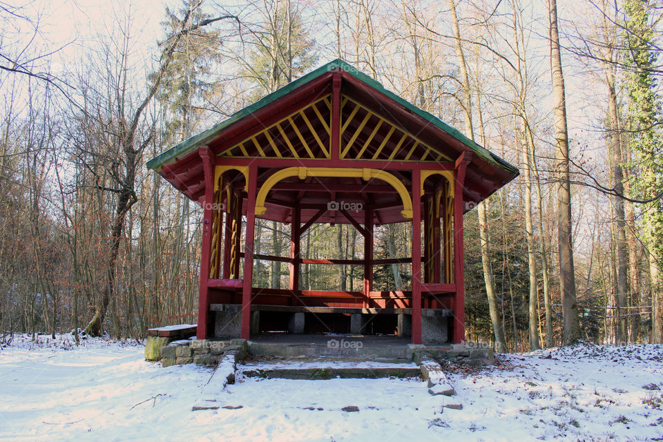wooden Pavillon in a forest in winter