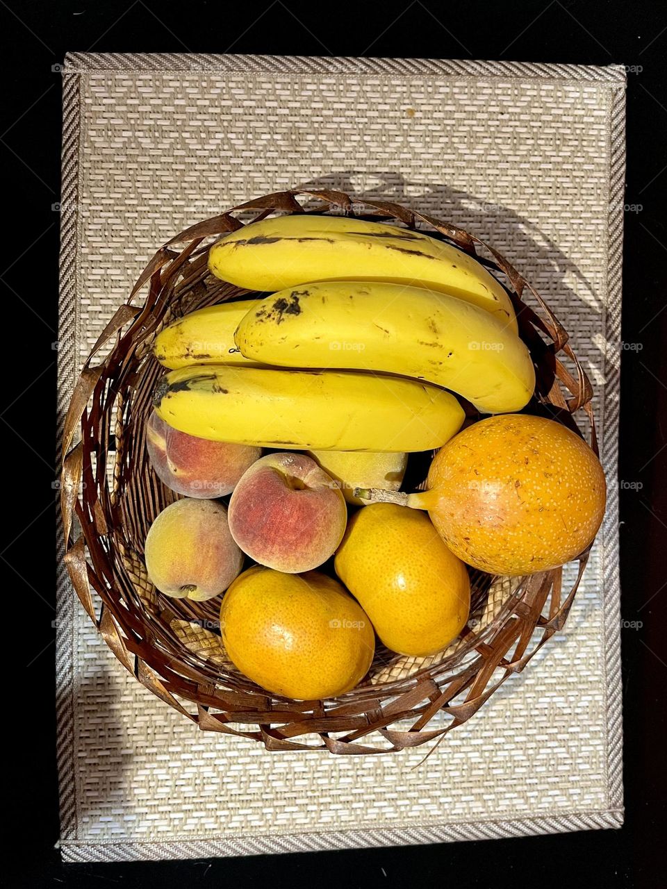 A basket with some yellow fruits