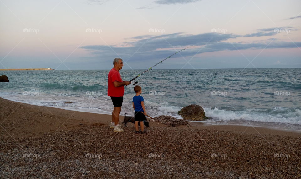 Granfather and grandson fish