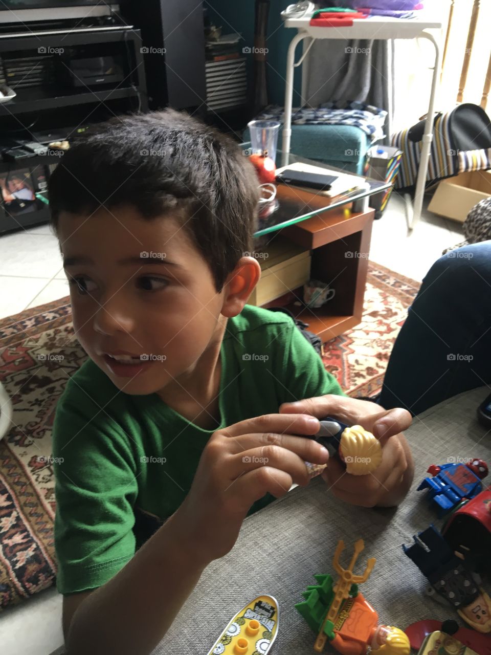 Boy playing with toys at home