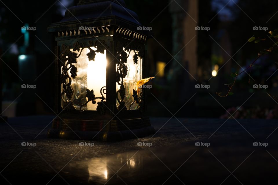 Light of a candle on the cemetery