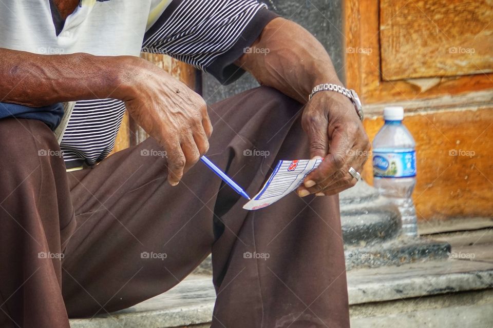 Man holding pen and paper