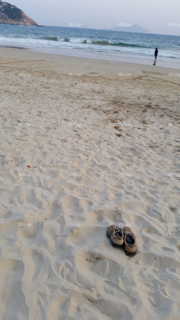 White sanded. Winter beach stroll
